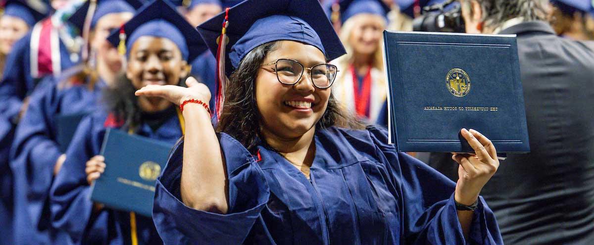 south alabama graduate posing with her diploma